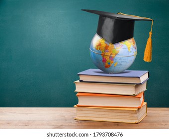 Graduated hat and world globe and books - Powered by Shutterstock