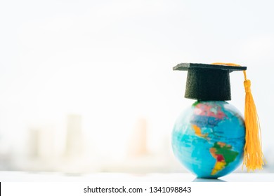 Graduated Study Abroad International,Back To School Concept. Graduation Hat On Top Earth Globe Model Map With City Backgrounds.