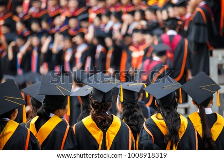 Graduates are stand up in line to get your degree ,vintage style,graduates cap behind isolated.