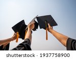 graduates student Graduation caps thrown in the Air Blue sky