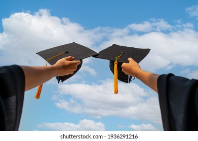 Graduates Student Graduation Caps Thrown In The Air Blue Sky