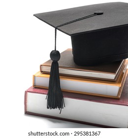 Graduation Cap And Book Isolated On White Background