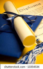 Graduation cap diploma and tassel