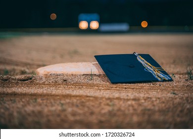 Graduation Cap And Gown On Baseball Field