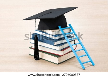 Graduation cap on a stack of colorful books with a blue ladder beside it in a bright and simple setting