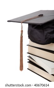 A Graduation Cap On Top Of A Stack Of Books On A White Background