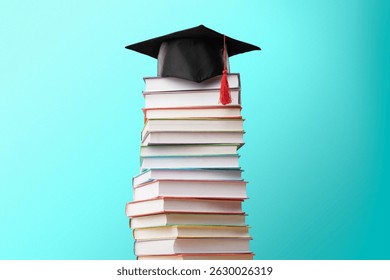 Graduation cap with reading books stack for education day