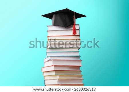 Graduation cap with reading books stack for education day