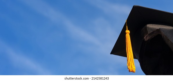 Graduation Caps Thrown In The Air Blue Sky On Background