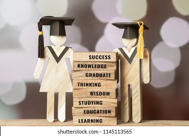 Graduation celebrating cap People Sign wood with on wooden square blocks tower blur bokeh. spelled out letter e.g education, graduate, learn. Ideas for international Educational Back to School Concept