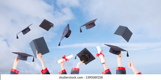 Graduation Ceremony Hats And Hands Up In Sunny Sky
