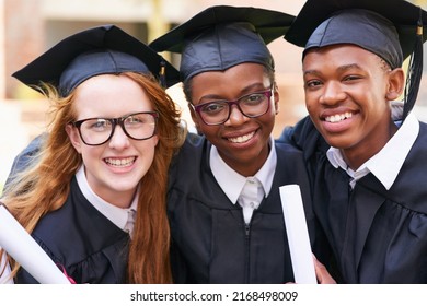 Graduation Day Is All About Us. Portrait Of A Happy Group Of Students Standing Outside On Their Graduation Day.