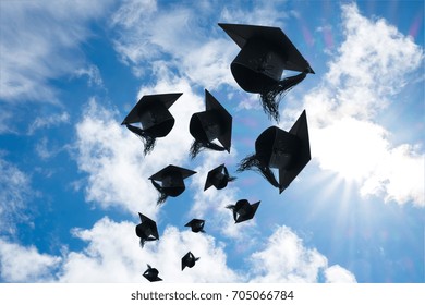 Graduation Day, Images Of Graduation Caps Or Hat Throwing In The Air With Sunshine Day On Blue Sky Background, Happiness Feeling, Commencement Day, Congratulation, Ceremony.