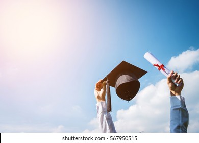 Graduation day, Images of graduates are celebrating graduation put hand up, a certificate and a hat in hand, Happiness feeling, Commencement day, Congratulation 