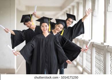 Graduation Day, Images Of Happily Graduates Are Celebrating Graduation, A Certificate In Hand, Happiness Feeling, Commencement Day, Congratulation. Education Concept.