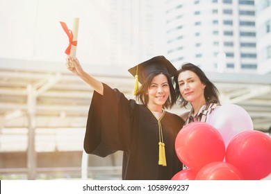 Graduation Day University Woman And Family.