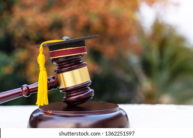 Graduation diploma hat / Judge gavel on school lawyer. Concept of graduate study international abroad about jurisprudence laws certificate in university, distance education for learning by self