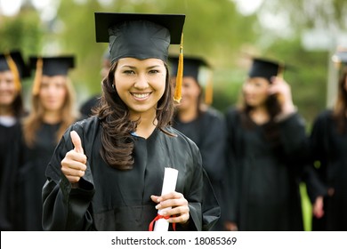 Graduation Girl Holding Her Diploma With Pride