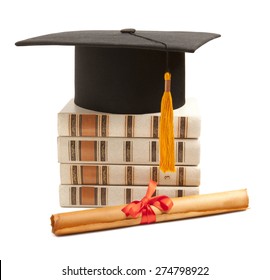 Graduation hat, book and diploma isolated on white