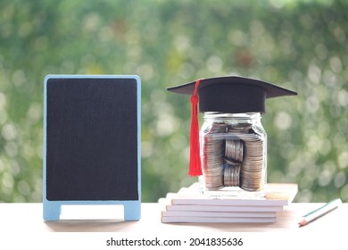 Graduation hat on the glass bottle and blackboard on natural green background, Saving money for education concept