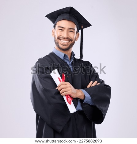 Graduation man, diploma and arms crossed in studio portrait with smile, success and pride for achievement. College graduate, asian student and certificate with goals, motivation and excited for award