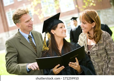 Graduation: Parents Looks At Graduate's Diploma