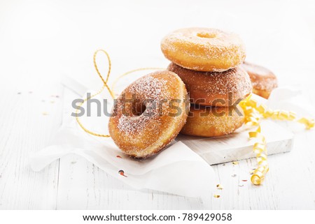 Graffe - tipical carnival italian fried donuts  on white wooden board, copy space.