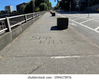 Graffiti On A Pavement In Downtown Seattle “SPD Kills” “Seattle Police Department Kills”