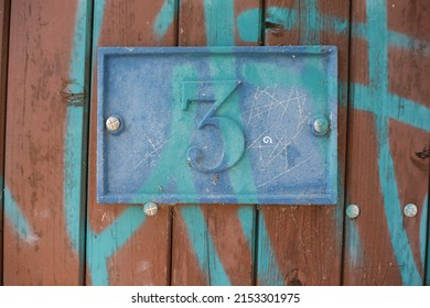 Graffitti On Door Of House Number 3