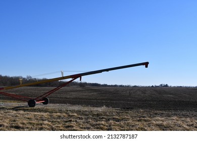 Grain Auger In A Farm Field