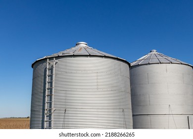 Grain Bin Storage System On Farm. Agriculture And Farming Equipment Safety, Maintenance, And Repair Concept