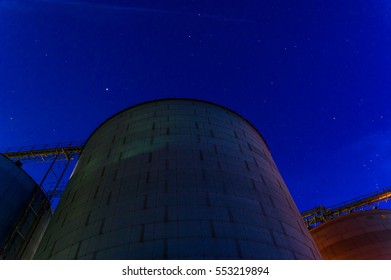 Grain Bins At Night In The Midwest