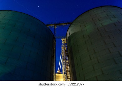 Grain Bins At Night In The Midwest