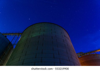 Grain Bins At Night In The Midwest