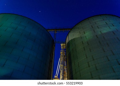 Grain Bins At Night In The Midwest