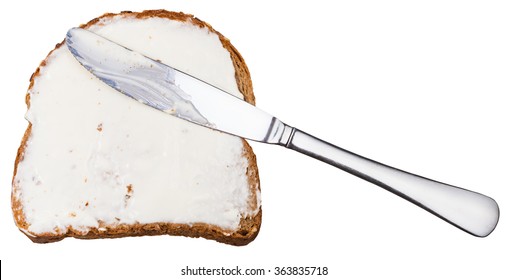 Grain Bread And Cheese Spread Sandwich With Table Knife Isolated On White Background