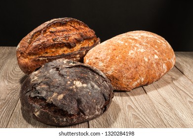 grain bread and fig bread with prunes on dark background - Shutterstock ID 1320284198