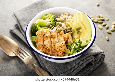 Grain And Grilled Chicken Bowl For Lunch With Pearl Barley, Avocado And Broccoli