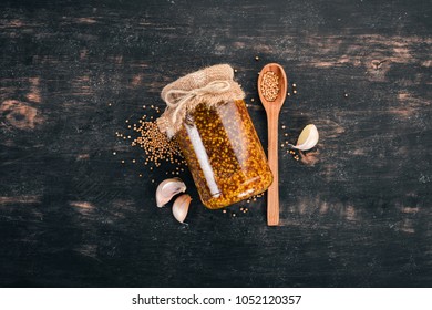 Grain Mustard. Spices On a dark wooden background. Top view. Copy space for your text. - Shutterstock ID 1052120357