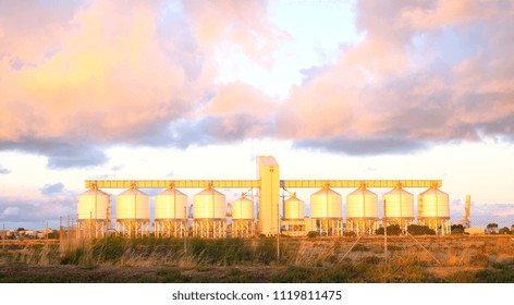Grain silos in Outer Harbor, South Australia where export grains such as wheat are conveyored to nearby shipping docks for export, at dawn.