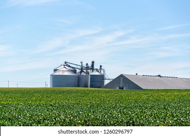 A grain storage facility on summer's day waiting for fall harvest.