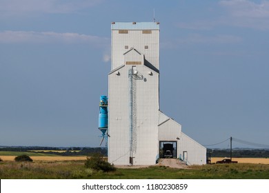 Grain Truck Unloading In Grain Elevator On The Prairie