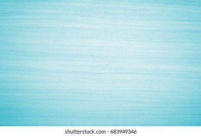 Grain wood image texture on blue cyan board background. Mint green Solid rustic table plywood in light teal pastel bacground, Vintage clean wooden tabletop pattern fake paper timber brush cool marble.