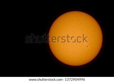 The grain-like surface of the sun with sunspots and solar flares photographed on April 15, 2019, with an H-alpha solar telescope from Mannheim in Germany.