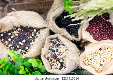 Grains, Beans, Grains And Rice In A Calico Bag On A Wooden Table. The Dried Rice Is A Component.