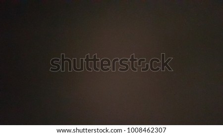 grains black fading background white light in the middle