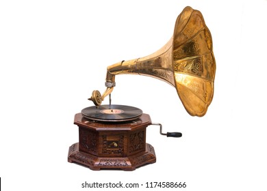 Gramophone is an Music device. Old gramophone with plate or vinyl disk on wooden box. Antique brass record player. Gramophone with horn speaker. Retro entertainment concept.