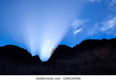 Gran Canaria, March Equinox Sun Shines Into Barranco De Fataga Ravine Though A Mountain Pass In Amurga Massif