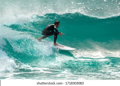 Gran Canaria / Spain - February 8, 2017: Surfer riding a crest of a wave in Gran Canaria Island , Spain.
