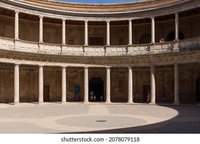 GRANADA, ANDALUSIA, SPAIN - CIRCA AUGUST, 2017: The circular patio of the Palace of Charles V (Palacio de Carlos V) with its Doric and Ionic columns in the Alhambra Complex, an UNESCO World Heritage.
